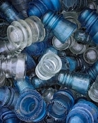 Vintage Hemingray blue and clear glass insulators for sale in a shop in Colorado.  Once a useful, vital part of our telephone and telegraph infrastructure, now a discarded (but beautiful!) curiosity looking for a second life as a decoration.