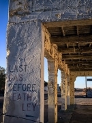 "Last Gas Before Death Valley": the sign almost says on this derelict service station in Death Valley Junction, CA.  The Amargosa opera house is in the background.