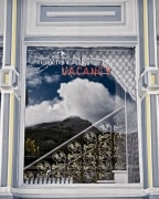 The reflection of the mountain and cloud in the hotel window was blended with the interior staircase inviting one to enter and climb to heaven.  There is hope that it’s not full yet indicated by the Vacancy sign!